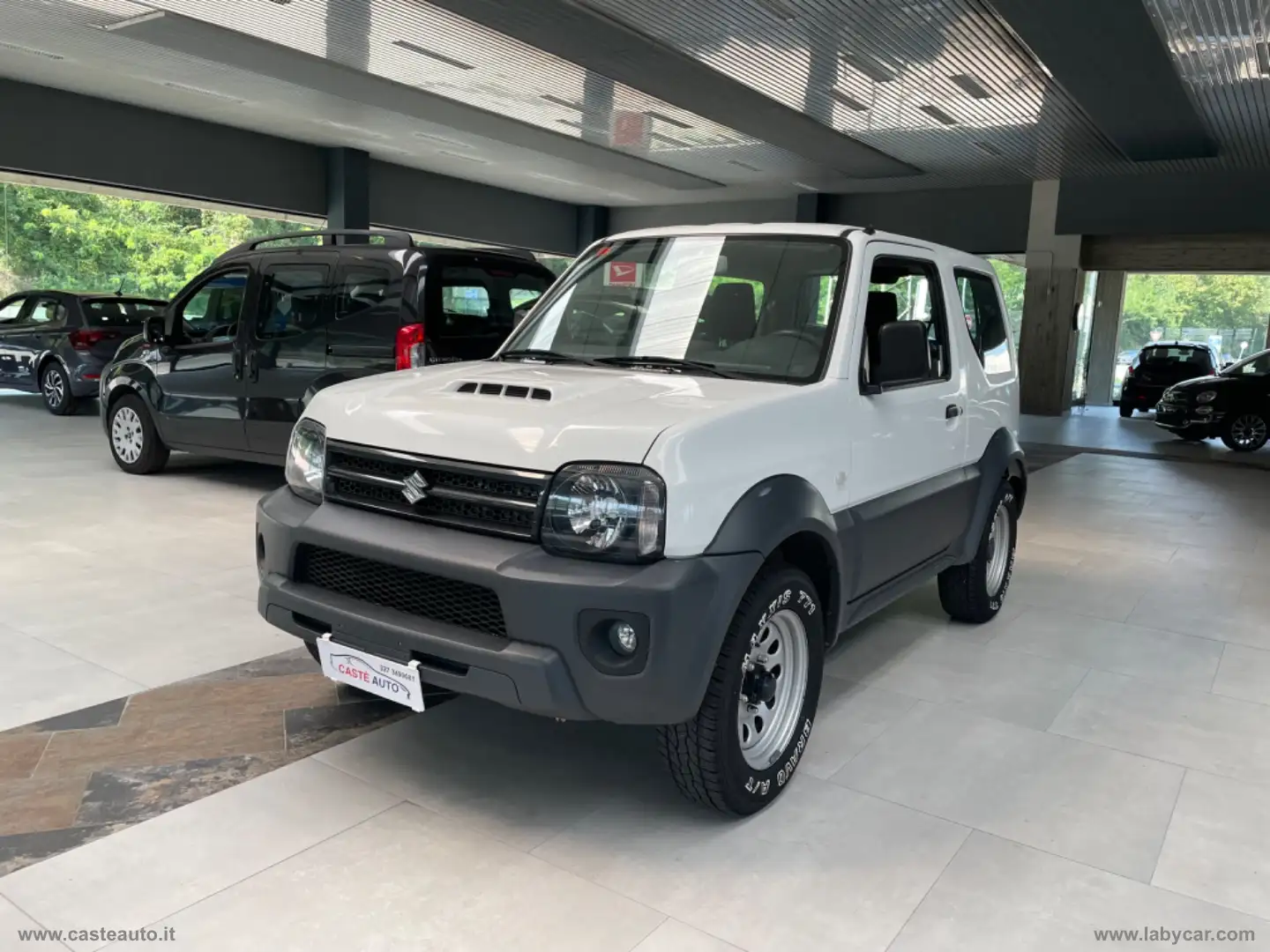 Suzuki Jimny 1.3 4WD Evolution GANCIO TRAINO Bianco - 1