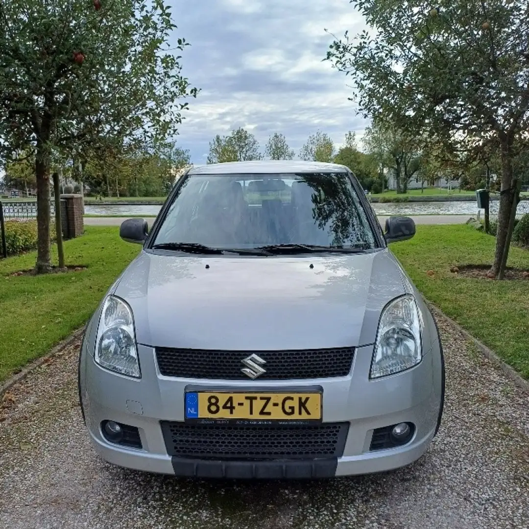 Suzuki Swift 1.3 SHOGUN + trekhaak + 4 winterbanden/wielen. Grijs - 2