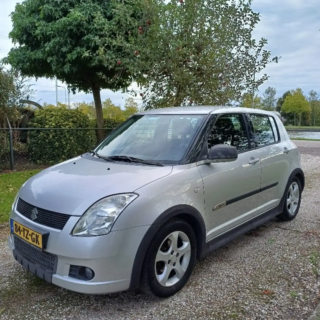 Suzuki Swift 1.3 SHOGUN + trekhaak + 4 winterbanden/wielen. Grijs - 1