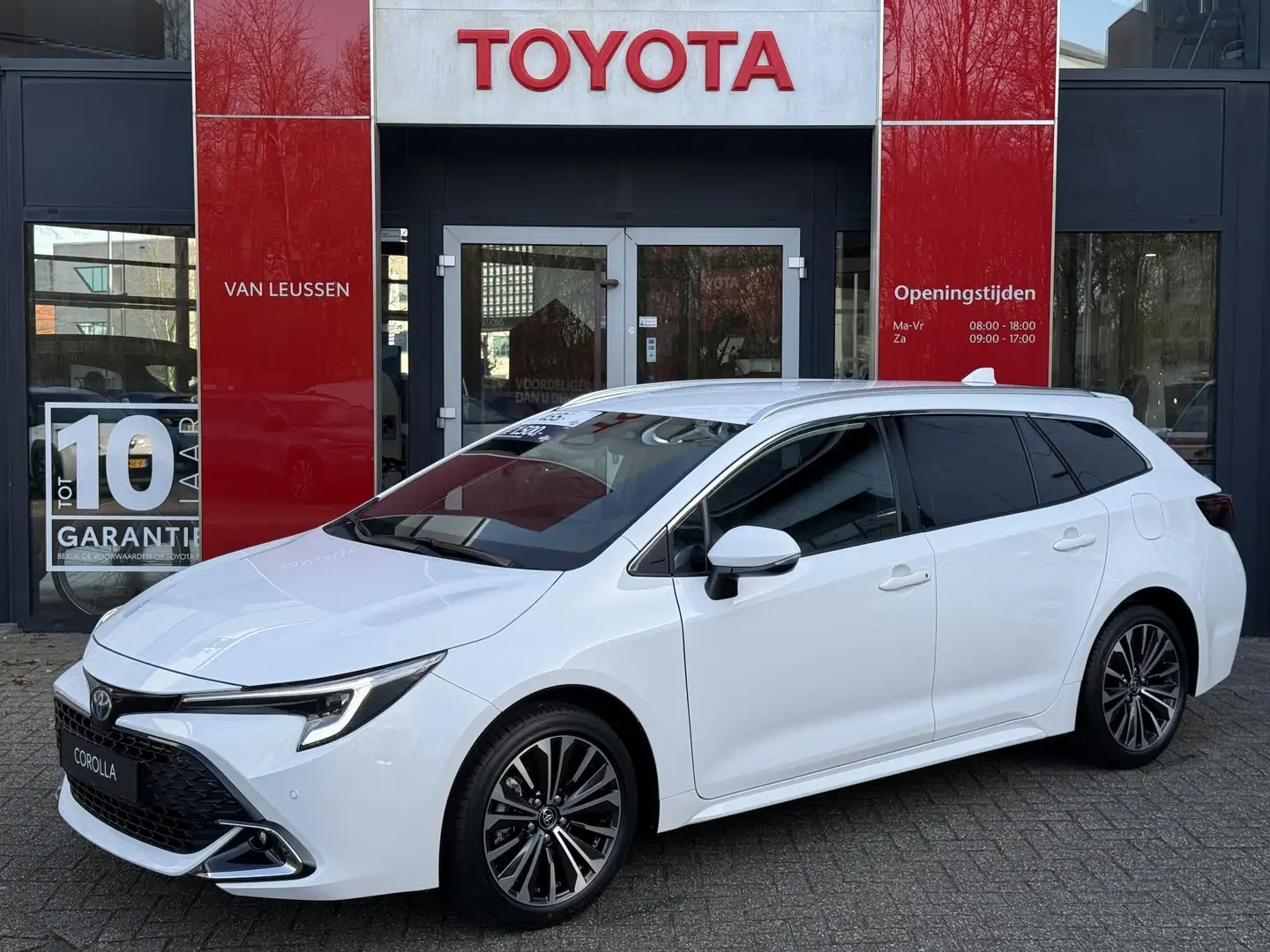 Toyota Corolla Touring Sports Hybrid 140 Business Plus NIEUW DIRE Wit - 1