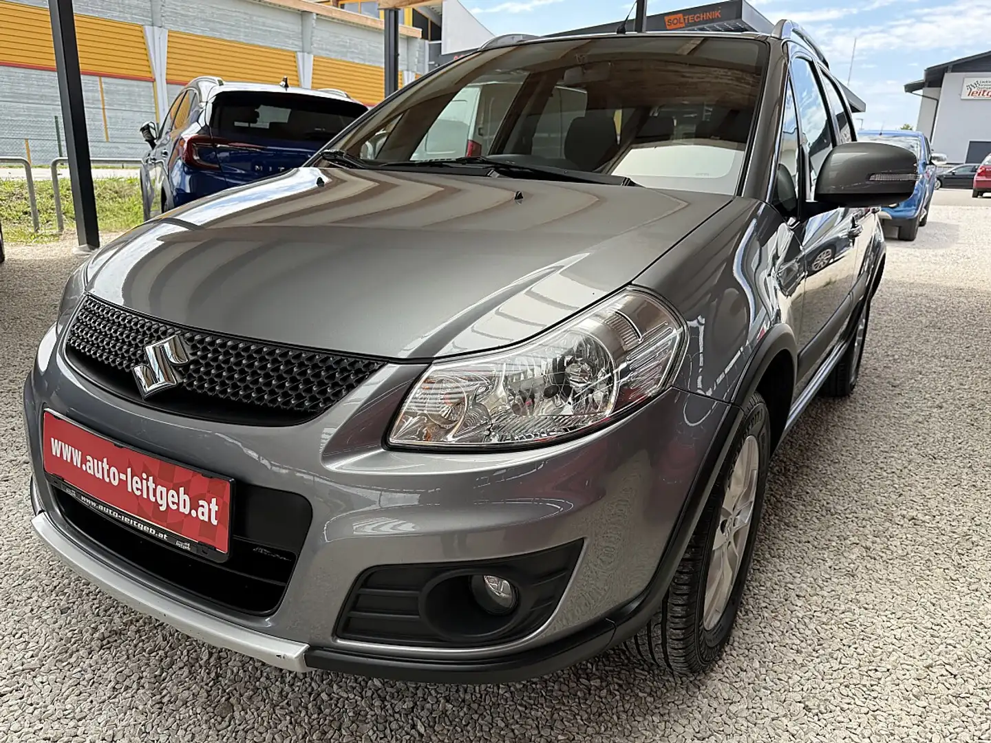 Suzuki SX4 1,6 GLX 4WD Traveller Grau - 1