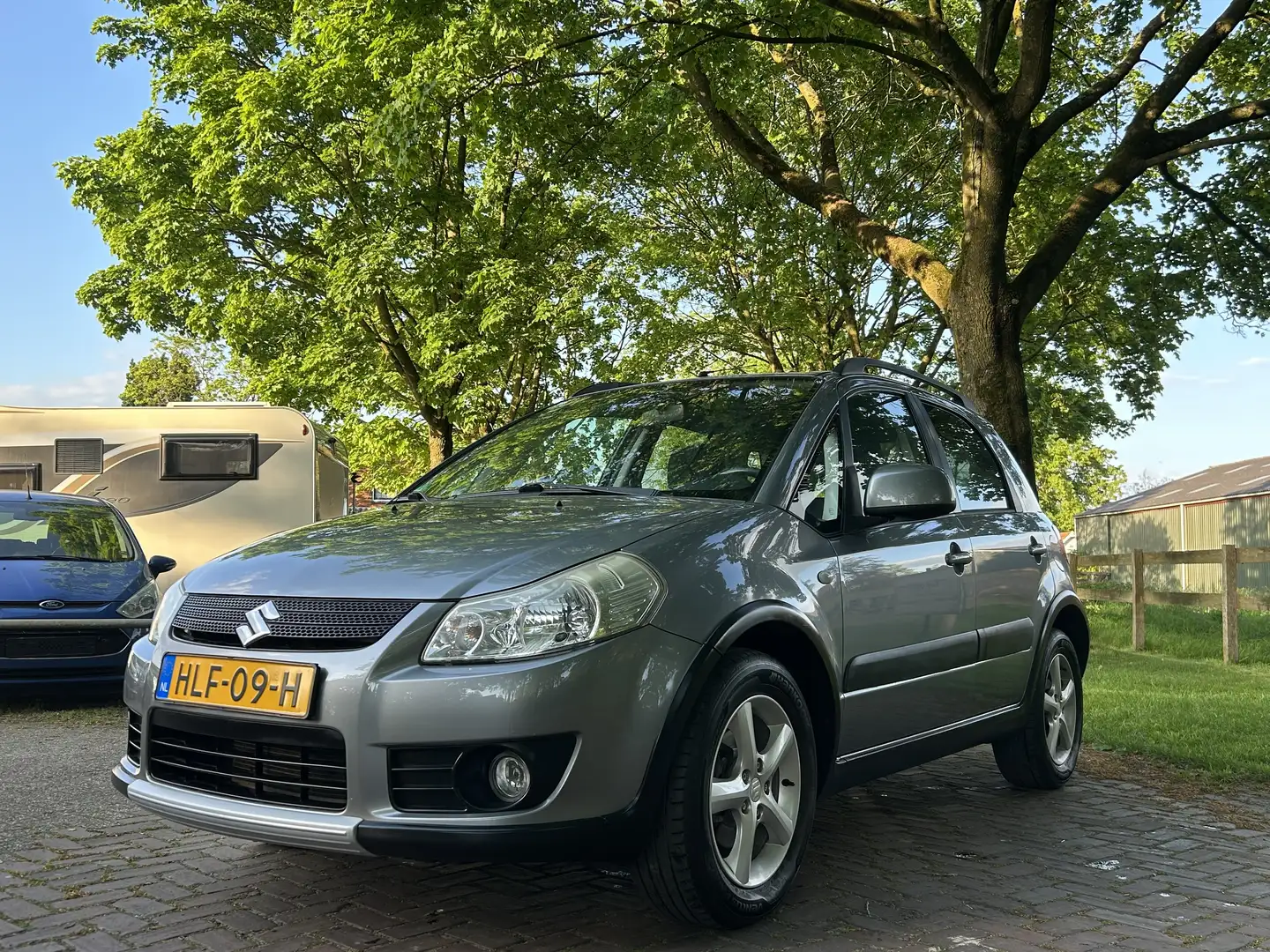 Suzuki SX4 1.6 Elekpakket,Navi,Stoelverwarming,LMV16” Gris - 1