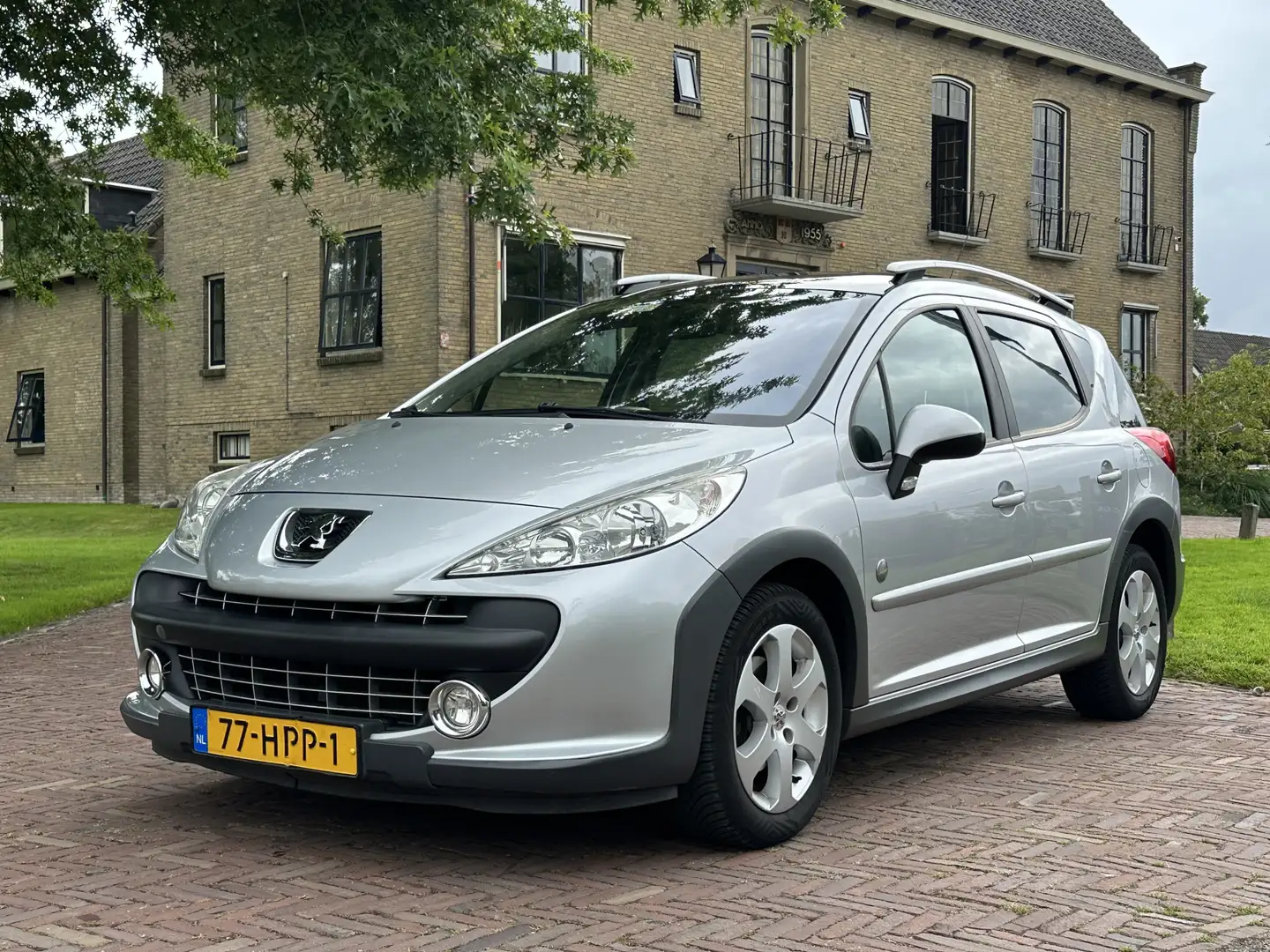 Peugeot 207 SW Outdoor 1.6 VTi NAP * PANO * LEER Gris - 1