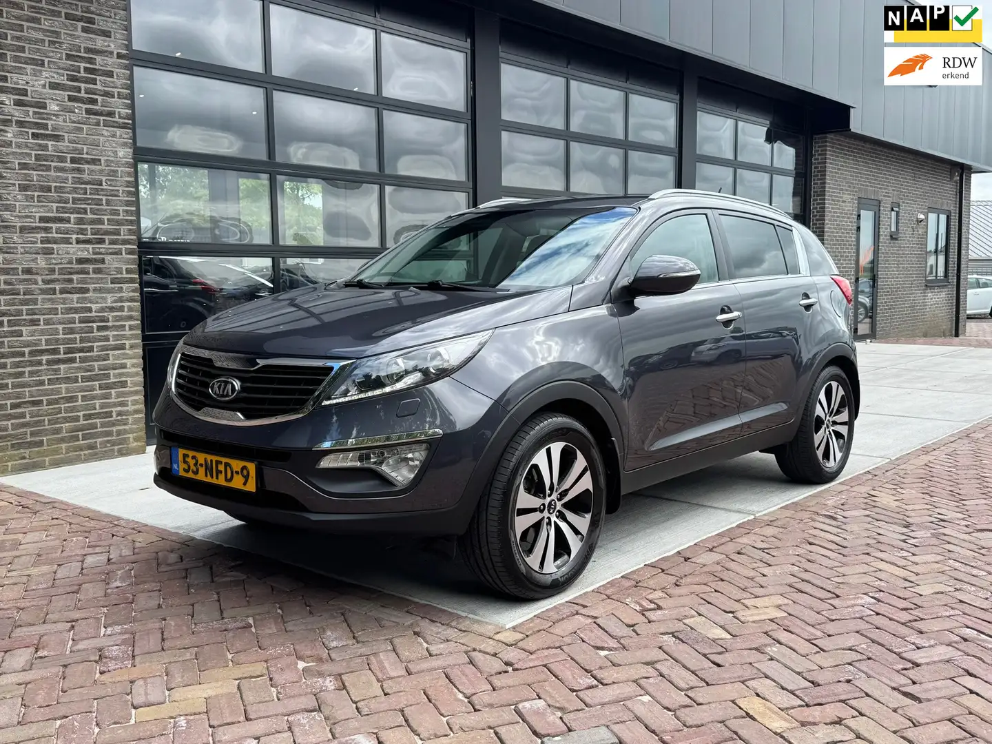 Kia Sportage 2.0 X-clusive | Navi | Cruise | Leer | Camera | Grijs - 1