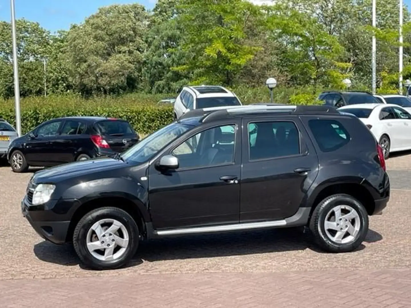 Dacia Duster 1.6 Aniversare 2wd,bj.2012,kleur:zwart,airco,leder Zwart - 1