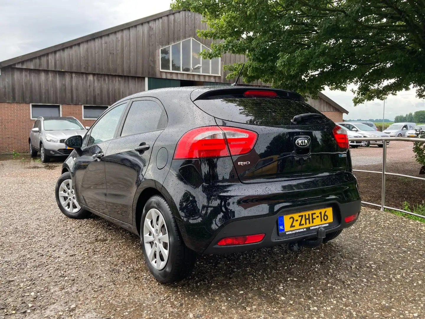 Kia Rio 1.2 CVVT BusinessLine | Navi + Airco + Cruise Nu € Zwart - 2