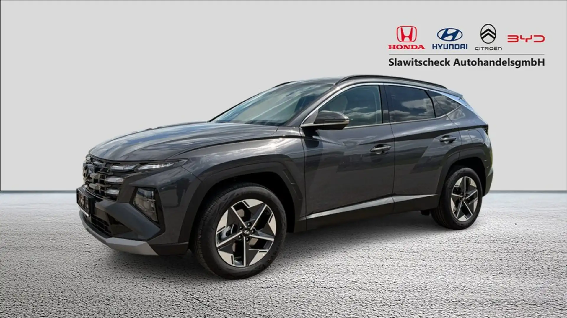 Hyundai TUCSON NX4 Comfort Line 1,6 T-GDi HEV 2WD AT inkl. Licht- und Smart Grau - 1