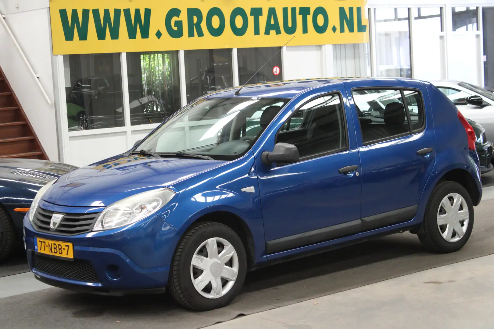 Dacia Sandero 1.2 Ambiance Volledig onderhouden, NAP, Airco, Iso Blauw - 1