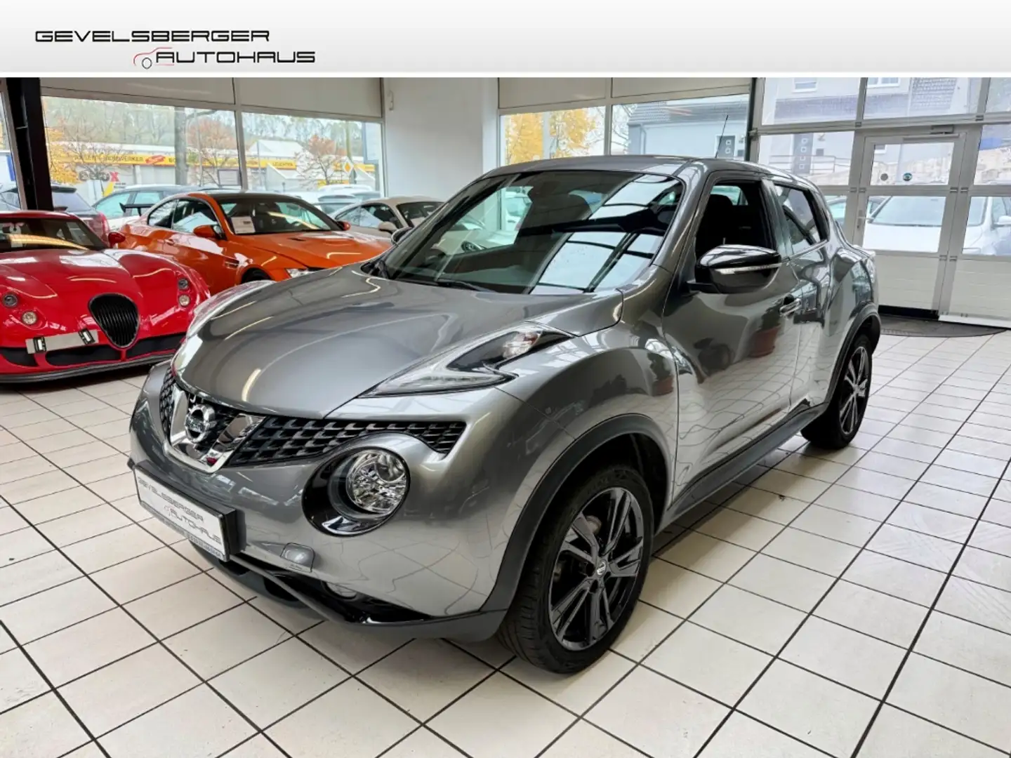 Nissan Juke N-Connecta 1.2 DIG-T 2.Hand+VFW Panorama Navi Klim Grijs - 1