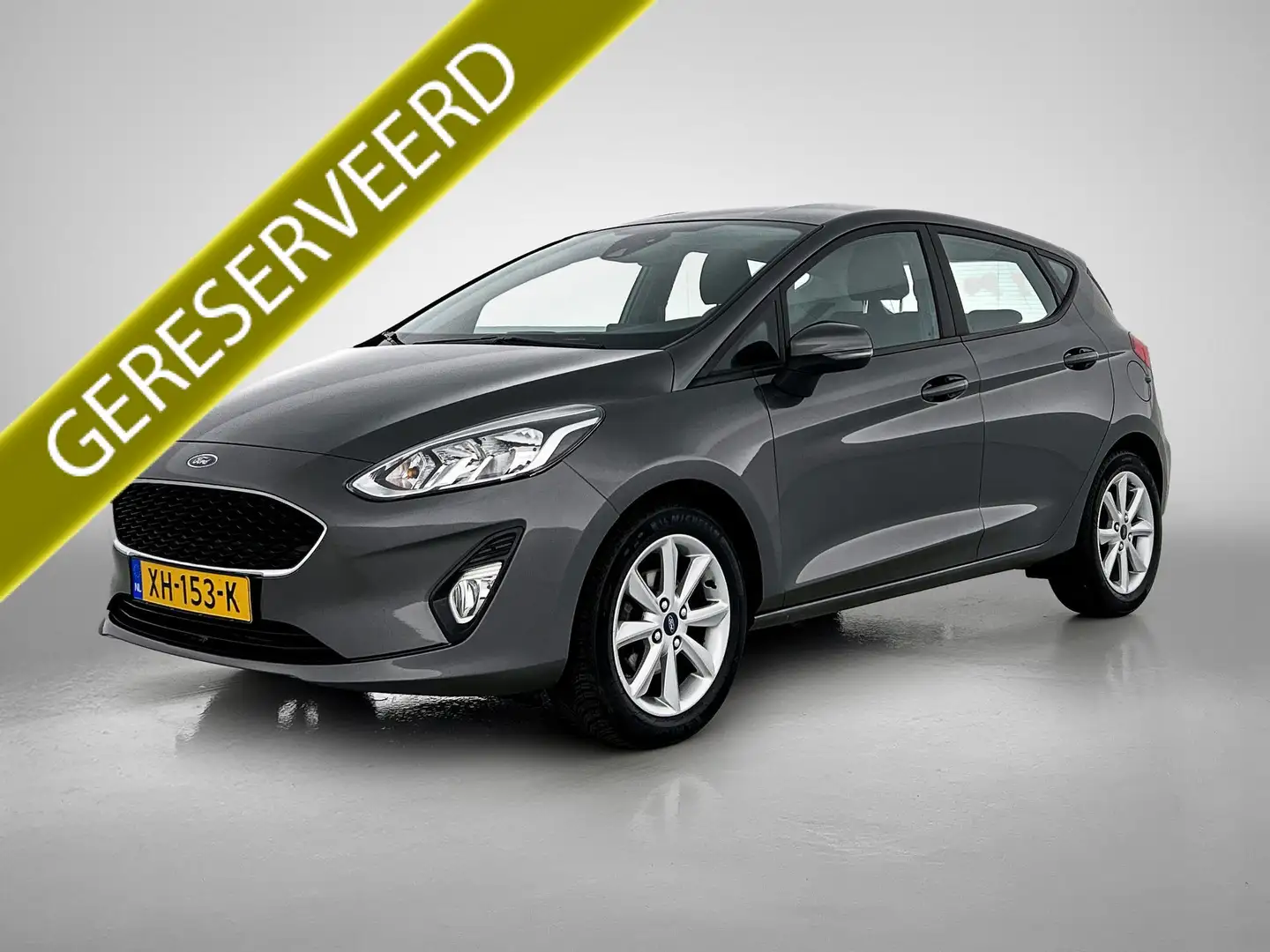 Ford Fiesta 1.1 85PK Trend 5Drs. / Navigatie / Airco / Parkeer Grijs - 1