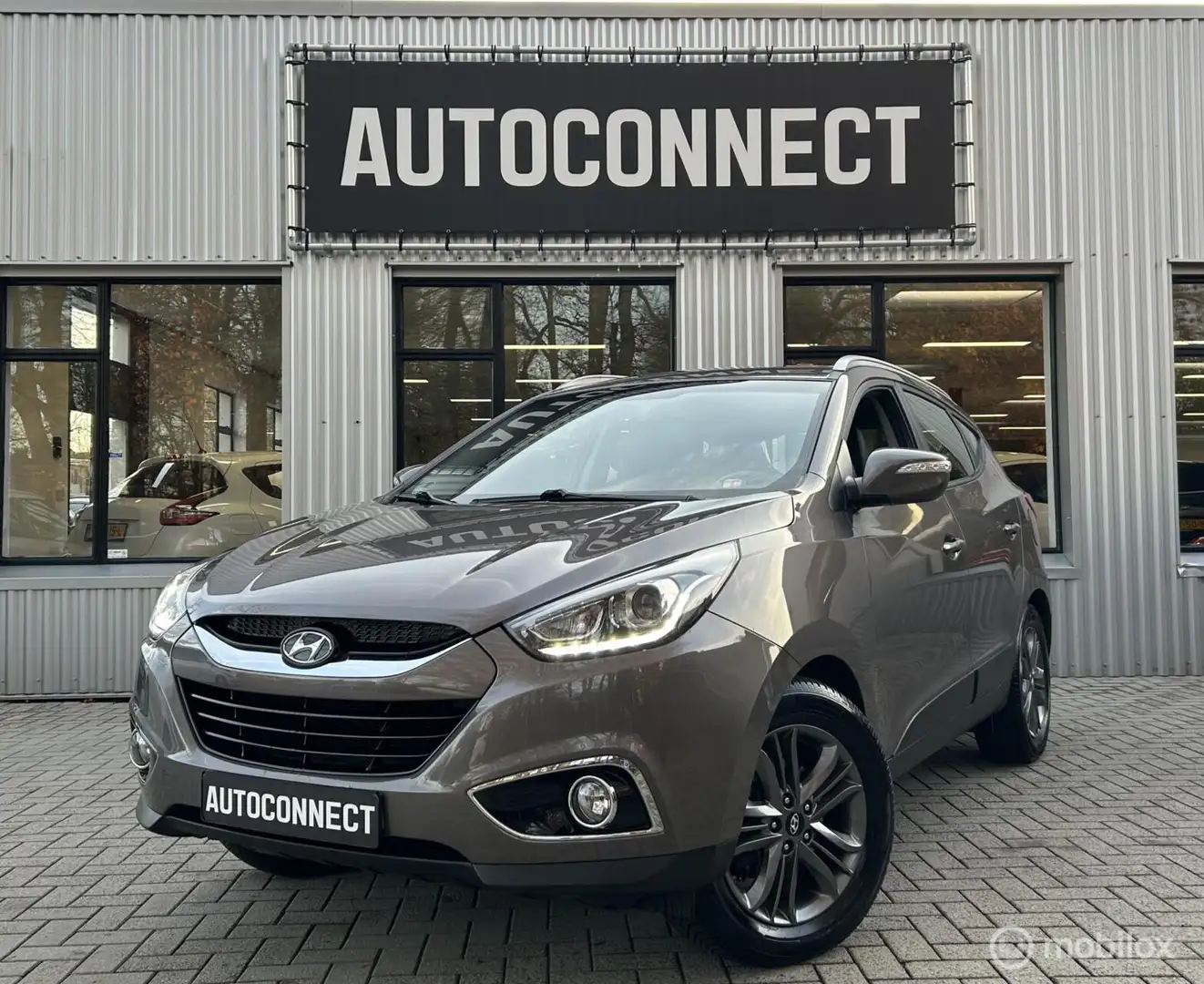 Hyundai iX35 2.0i i-AUTOMAAT, TREKH, HALF/LEDER, CRUISE Bruin - 1