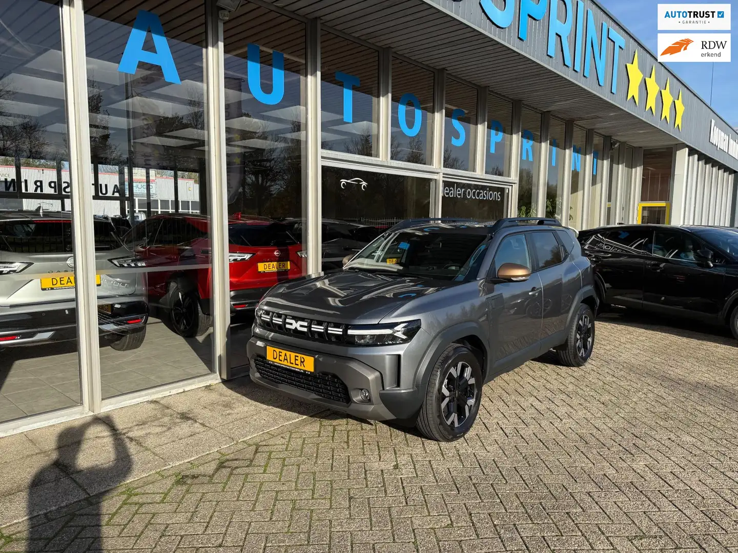 Dacia Duster 1.6 Hybrid 140 Extreme / ACHTERUITRIJCAMERA / CARP Grijs - 1