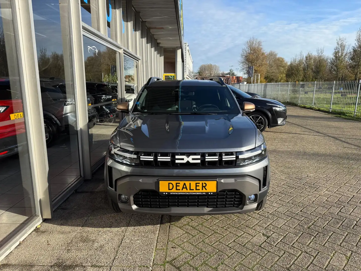 Dacia Duster 1.6 Hybrid 140 Extreme / ACHTERUITRIJCAMERA / CARP Grijs - 2