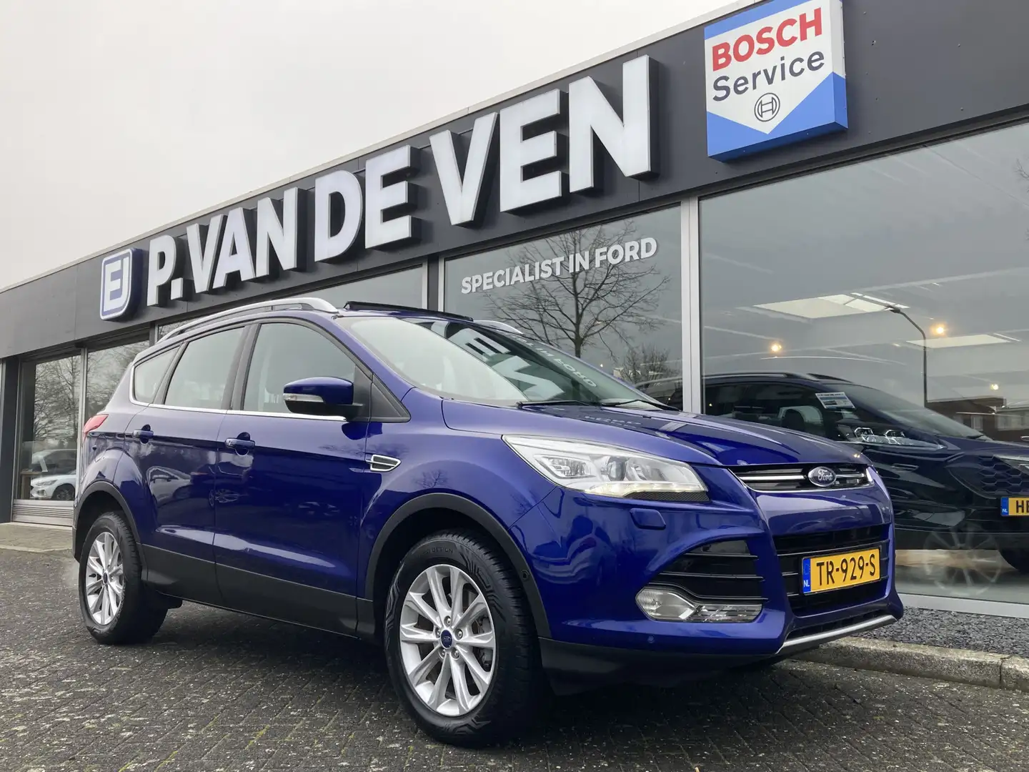 Ford Kuga 1.5 EcoBoost Titanium 110kW/150pk 6-bak | Panorama Blauw - 1