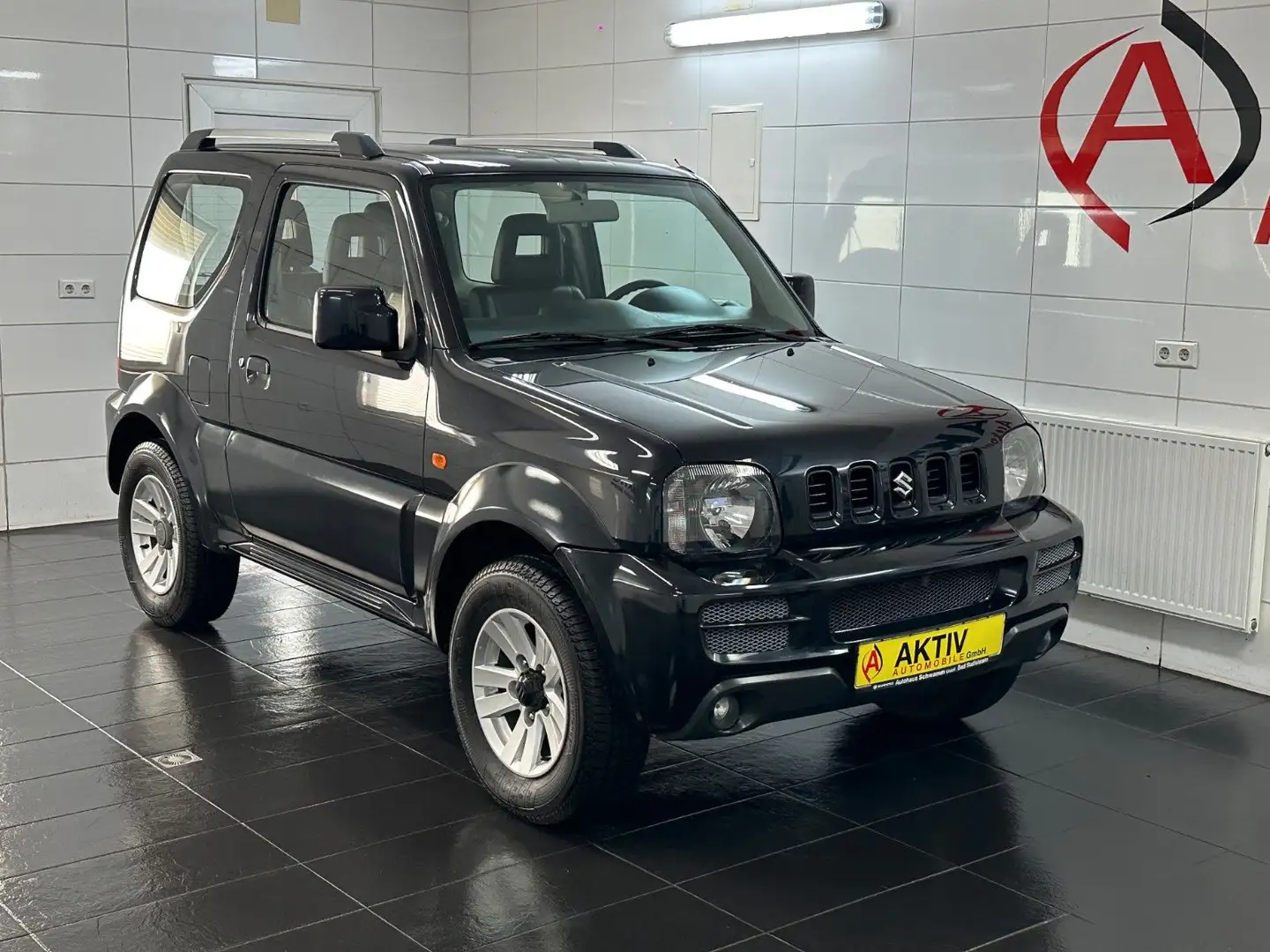 Suzuki Jimny 1.3 Style 4WD *Leder*Klima*SHZ* Noir - 1