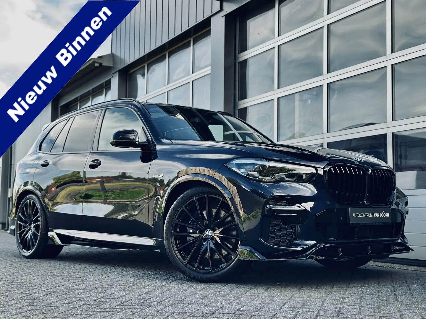 BMW X5 xDrive45e | Exclusive | M-pakket | Panodak | Lucht Zwart - 1