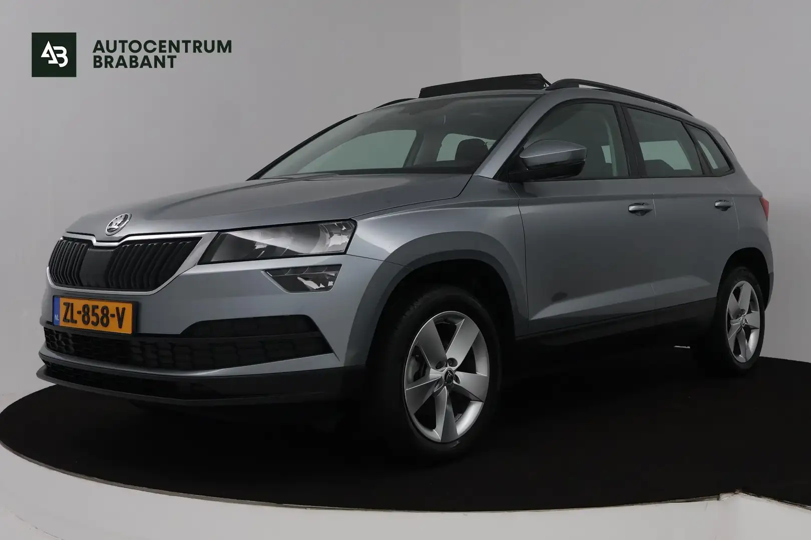 Skoda Karoq 1.0 TSI Ambition Business (PANORAMADAK, TREKHAAK, Grijs - 1
