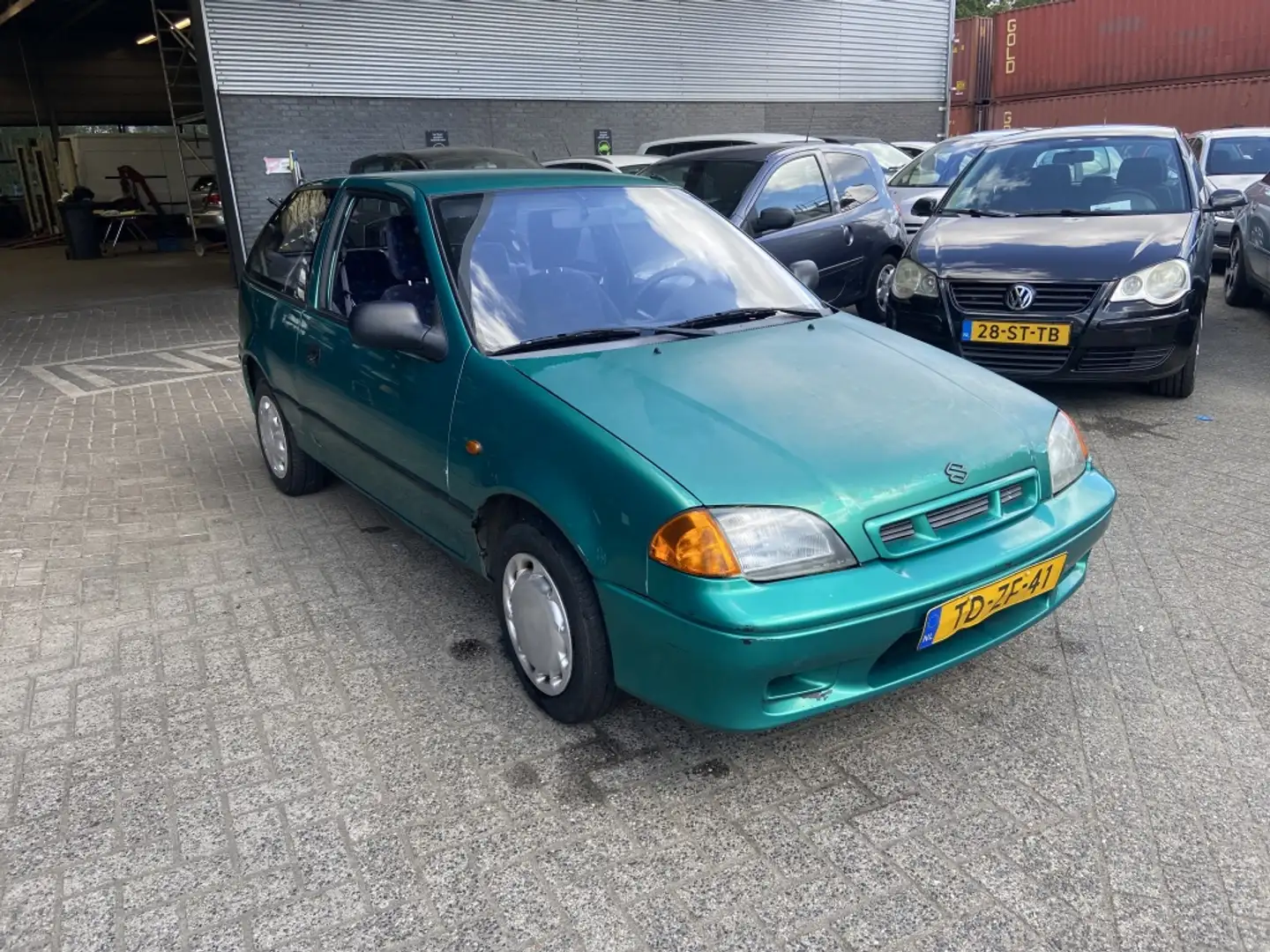 Suzuki Swift 1.3 GLS Verde - 1