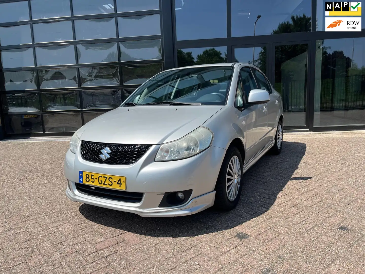 Suzuki SX4 Exclusive, Airco, 1 eigenaar, Trekhaak Grijs - 1