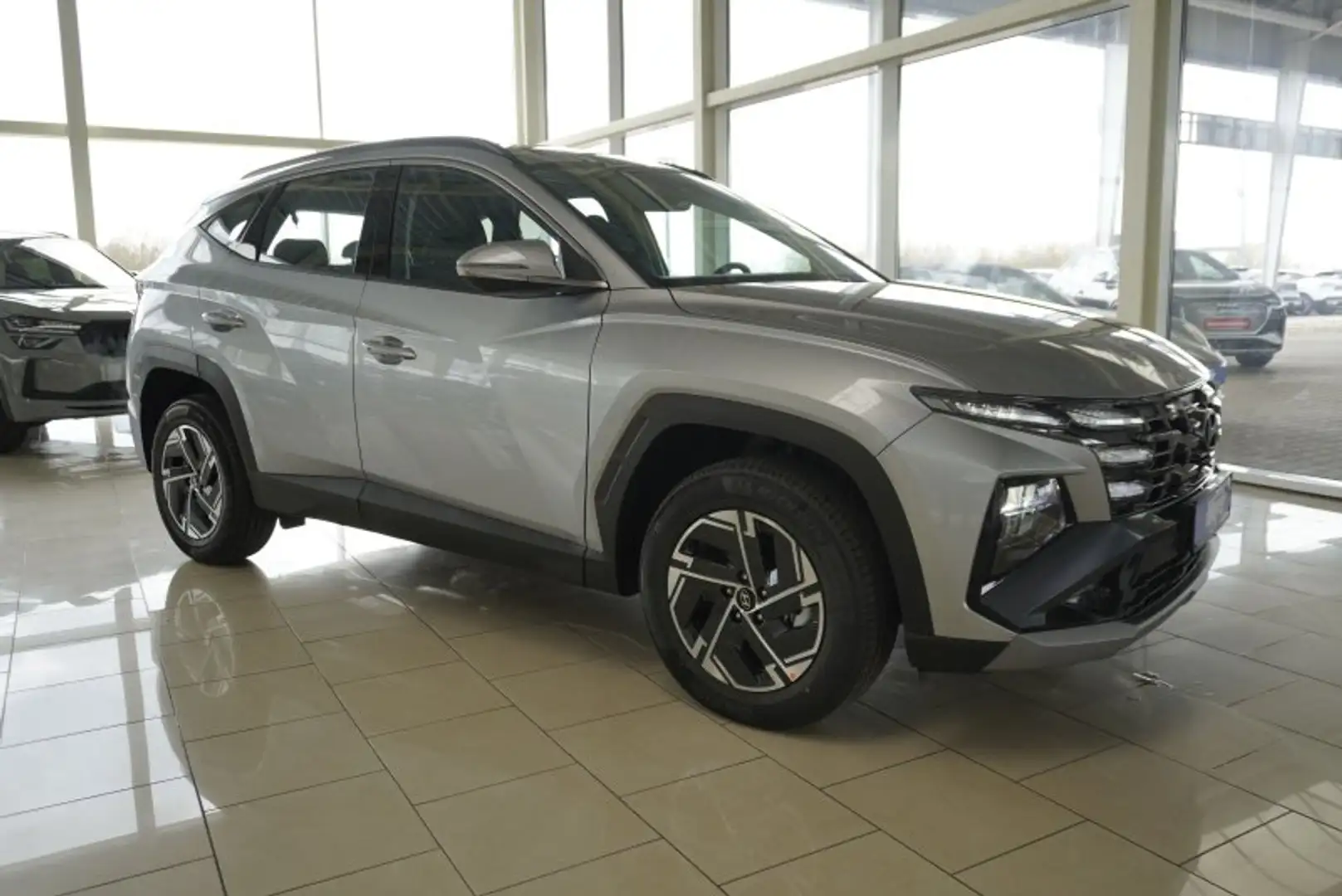 Hyundai TUCSON 1.6 T-GDI HEV 215PS Navi/Kamera/Keyless/Voll-LED Silber - 1