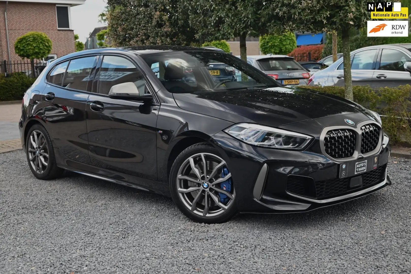 BMW 135 1-serie M135i xDrive High Executive 306 PK Dealer Zwart - 1