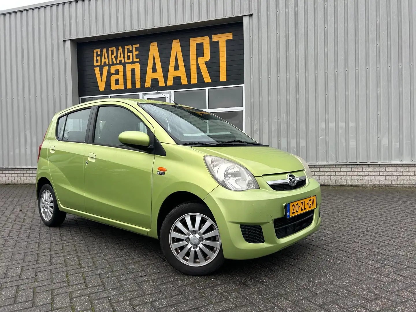 Daihatsu Cuore 1.0 Premium | AIRCO | DEALER OH | APK 12-2026 | Grün - 1