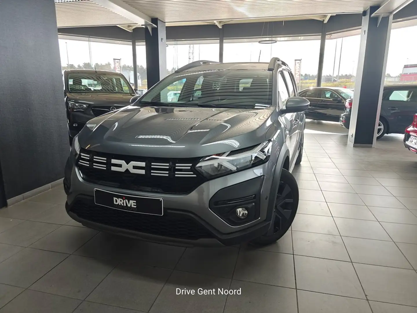 Dacia Jogger TCe 110 Expression 5PL *City-Pack/Camera/Trekhaak* Gris - 1
