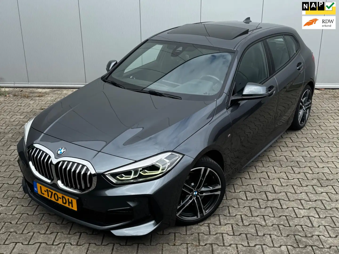 BMW 118 1-serie 118i HIGH EXECUTIVE M SPORT PANORAMADAK VI Gris - 1
