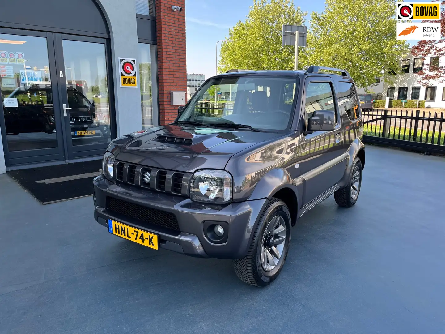Suzuki Jimny 1.3 Exclusive LEDER STOELVERWARMING AIRCO LMV Gris - 1