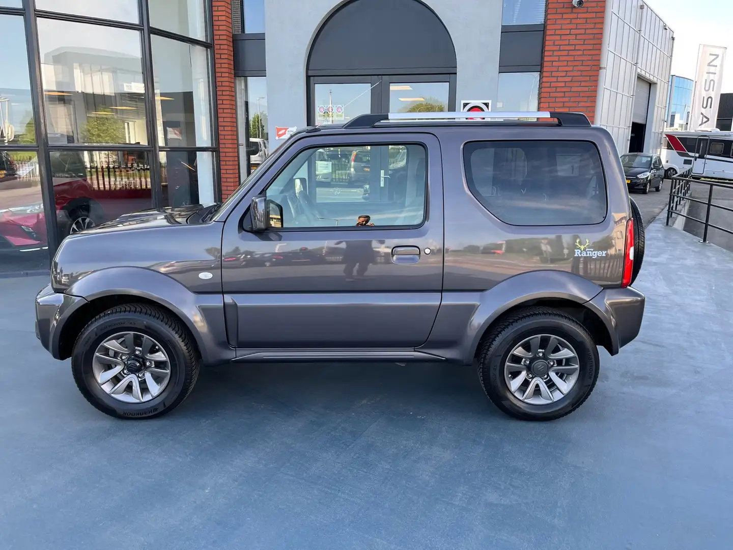 Suzuki Jimny 1.3 Exclusive LEDER STOELVERWARMING AIRCO LMV Gris - 2