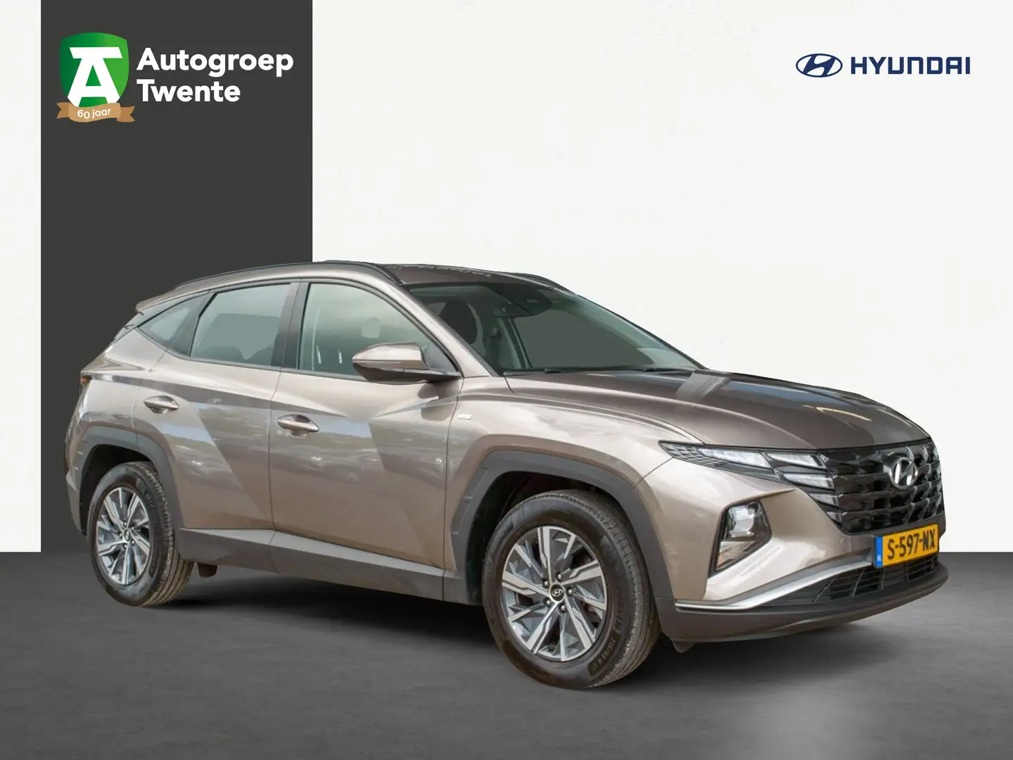 Hyundai TUCSON 1.6 T-GDI MHEV i-Motion | Carplay Navigatie | Trek Bruin - 1