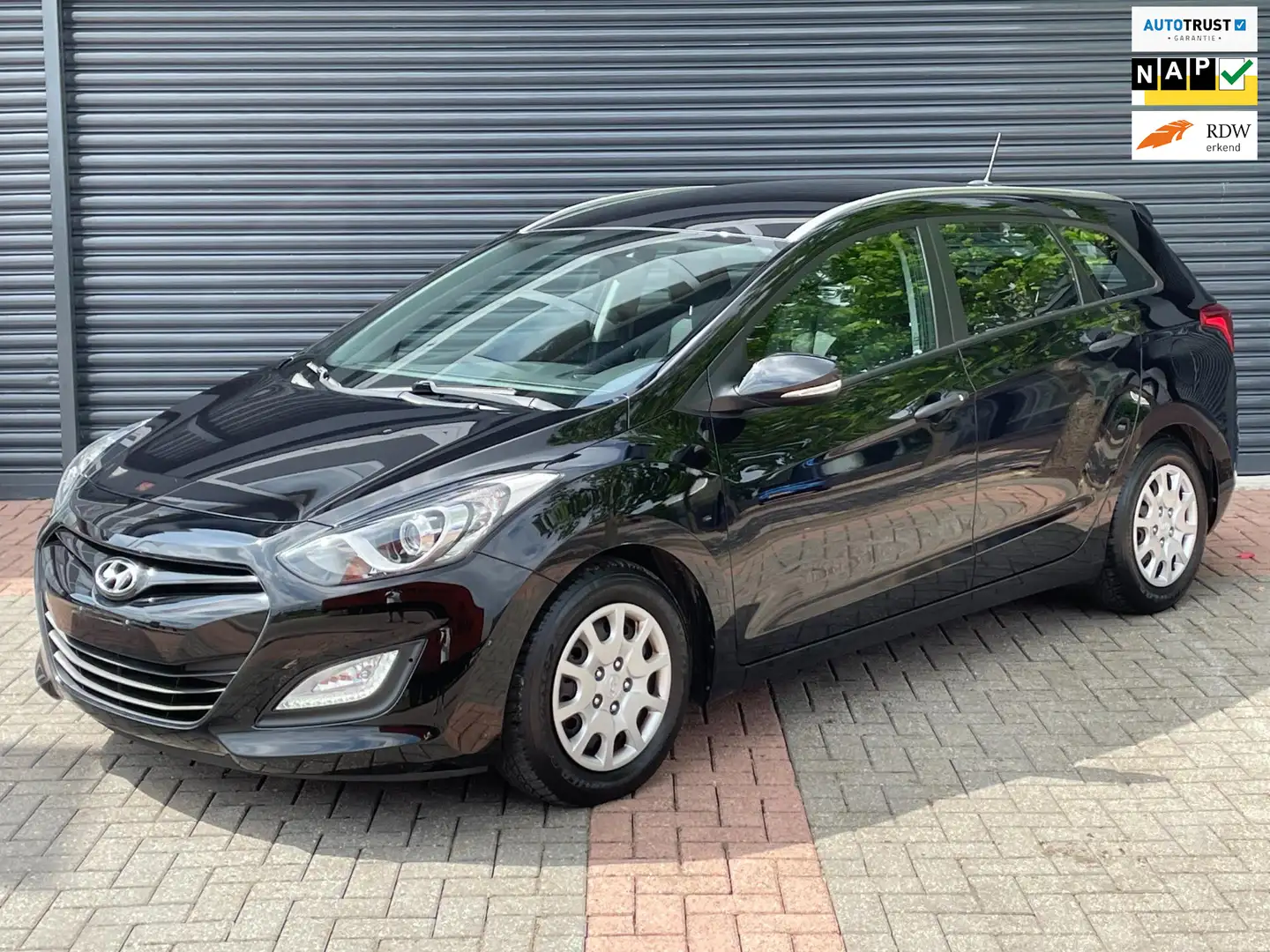 Hyundai i30 CW 1.4i i-Motion Business Cruise | Pdc | Navi | We Zwart - 1