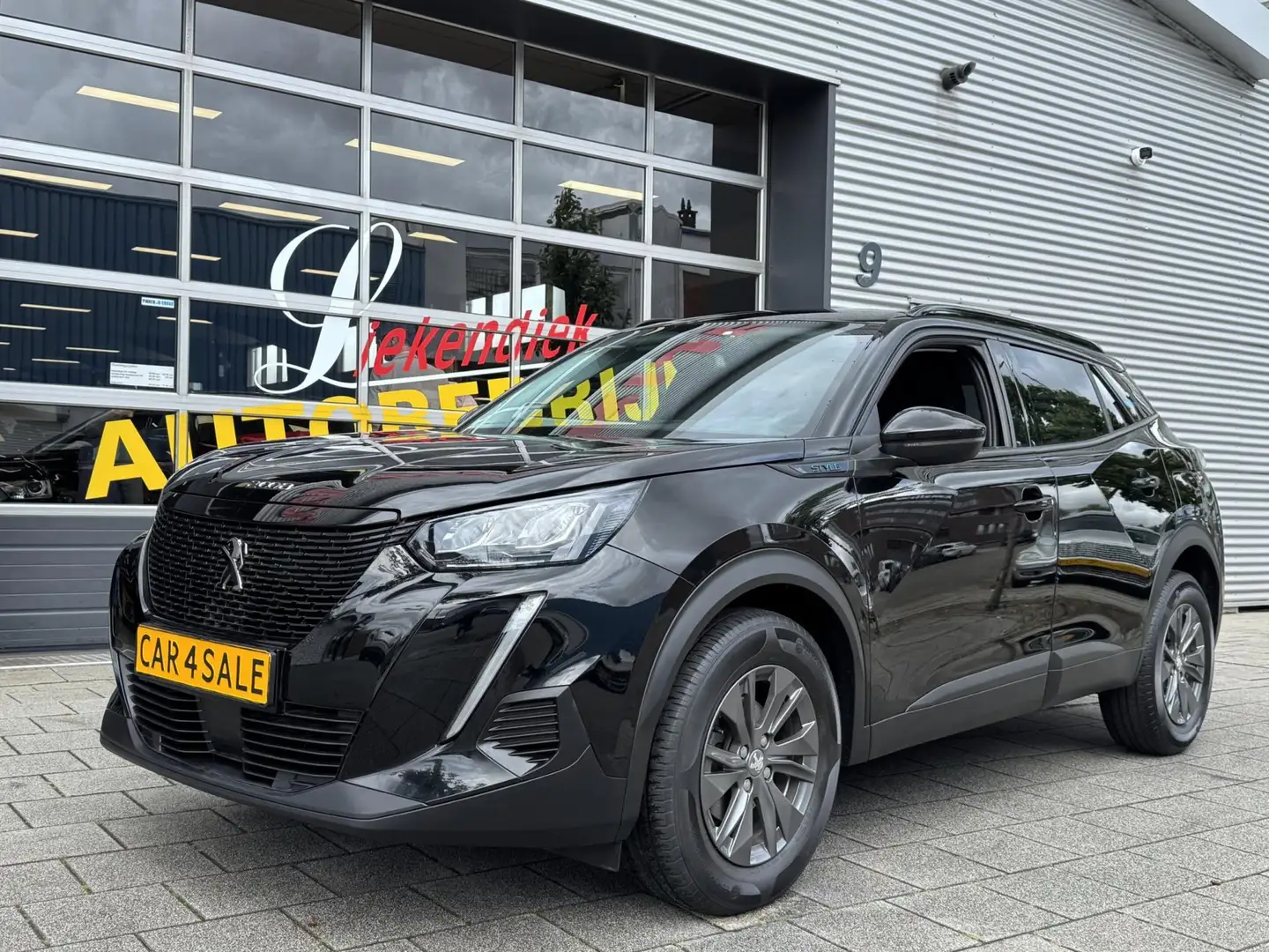 Peugeot 2008 1.2 PureTech STYLE Pack - Navigatie I Airco I PDC Zwart - 1