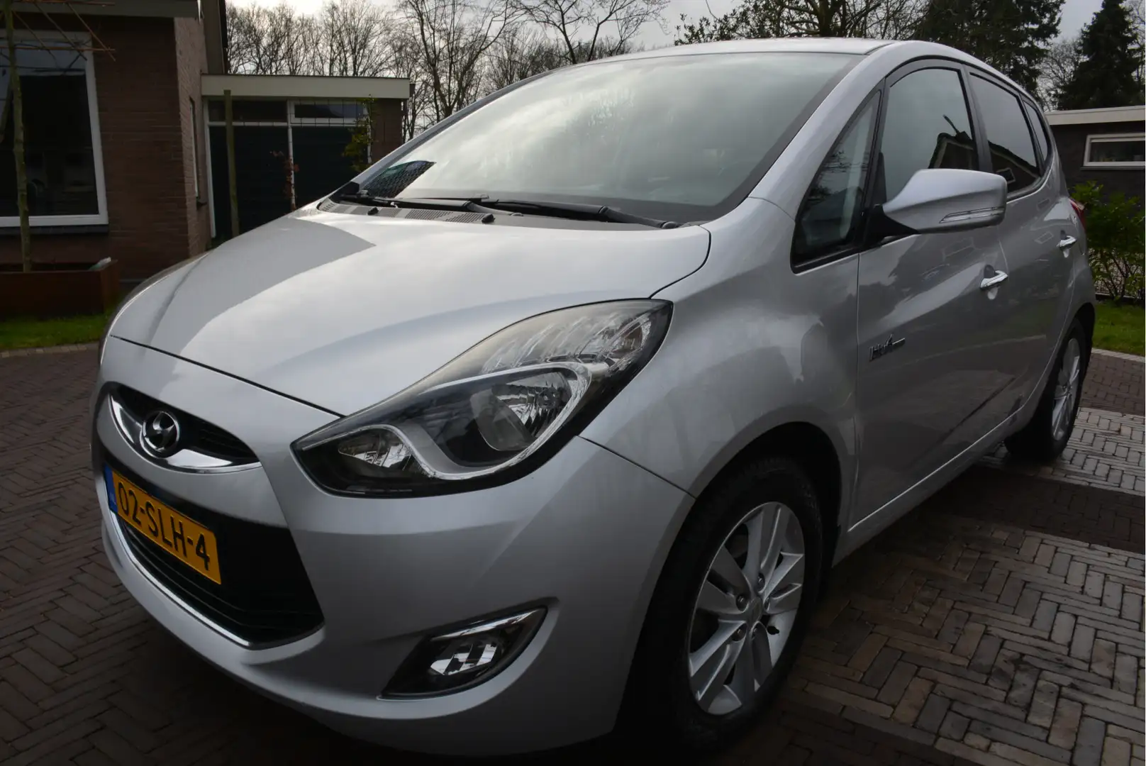 Hyundai iX20 1.4i i-Vision Trekhaak Airco PDC Cruise Control Gris - 1