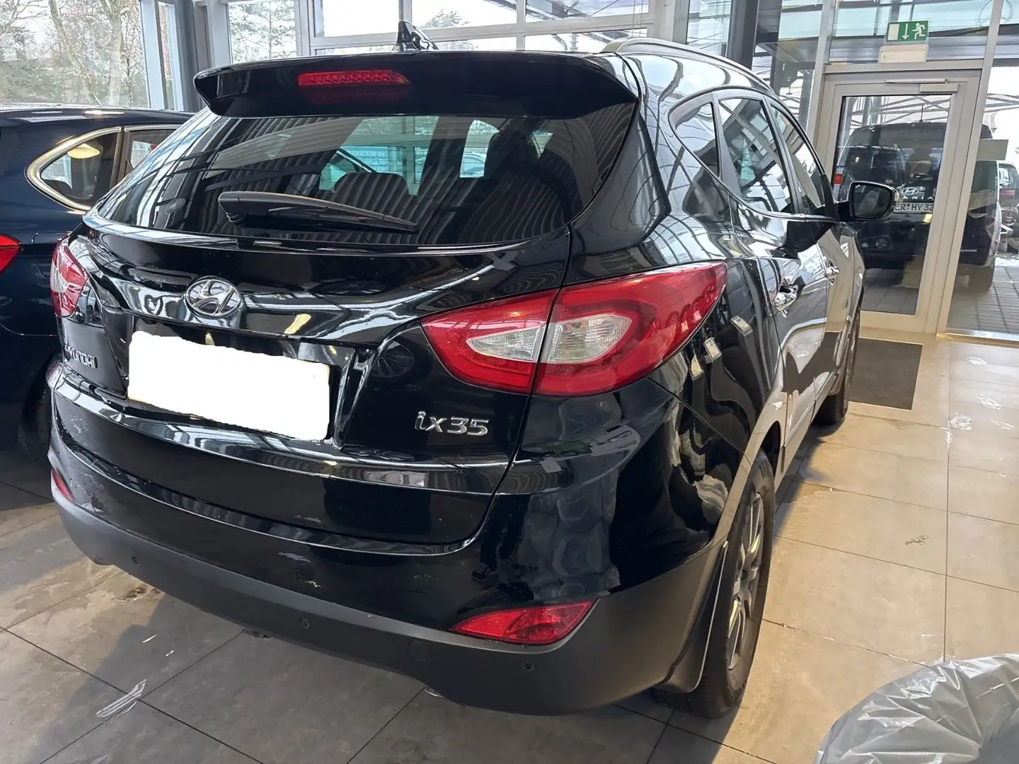 Hyundai TUCSON ix35 2.0 GDI Comfort/Voll Leder/AHK/Bi Xenon/Kam Schwarz - 1