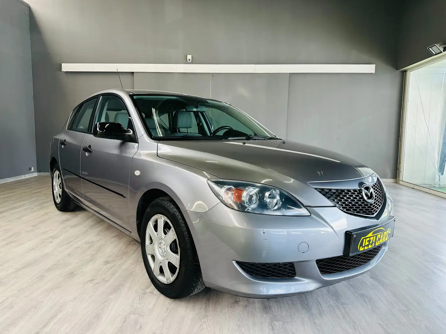 Mazda 3 1.3i 16v i Active * 1 Jaar Garantie * Gris - 1