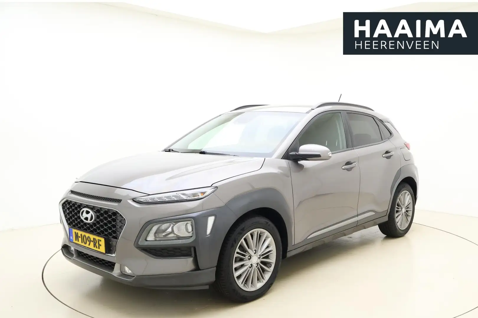 Hyundai KONA 1.0T Fashion 120 pk | Trekhaak | Climate control | Grijs - 1