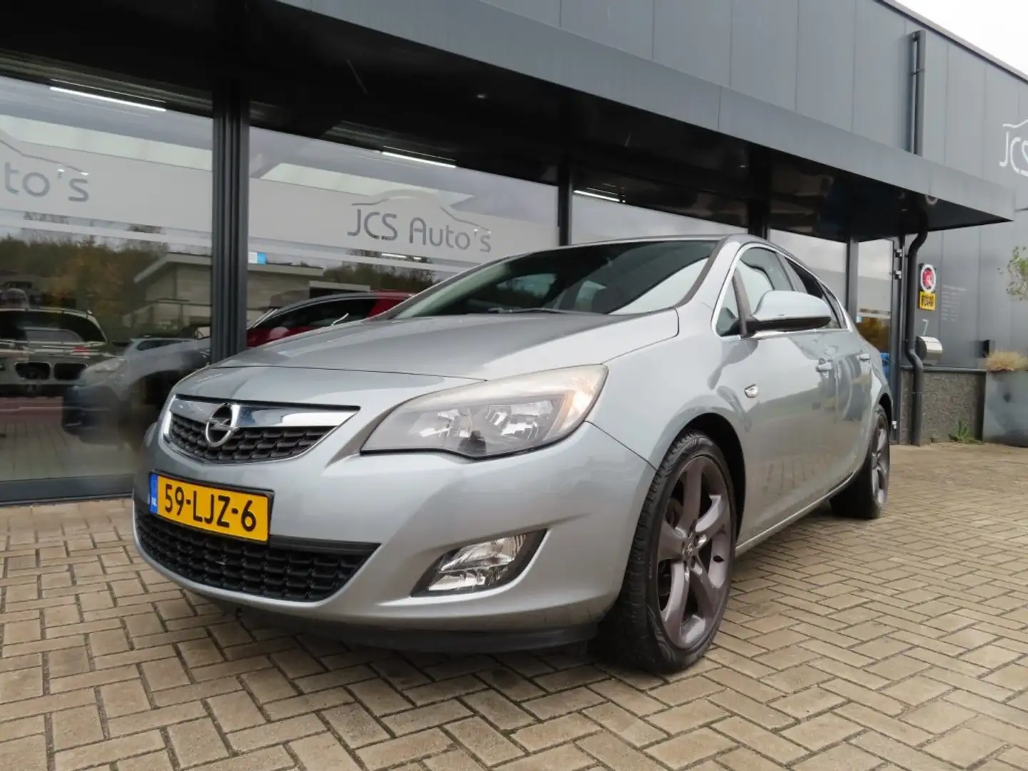 Opel Astra 1.4 Turbo Sport Ecc Cruise Navi 19 Inch 2010 Grijs - 1