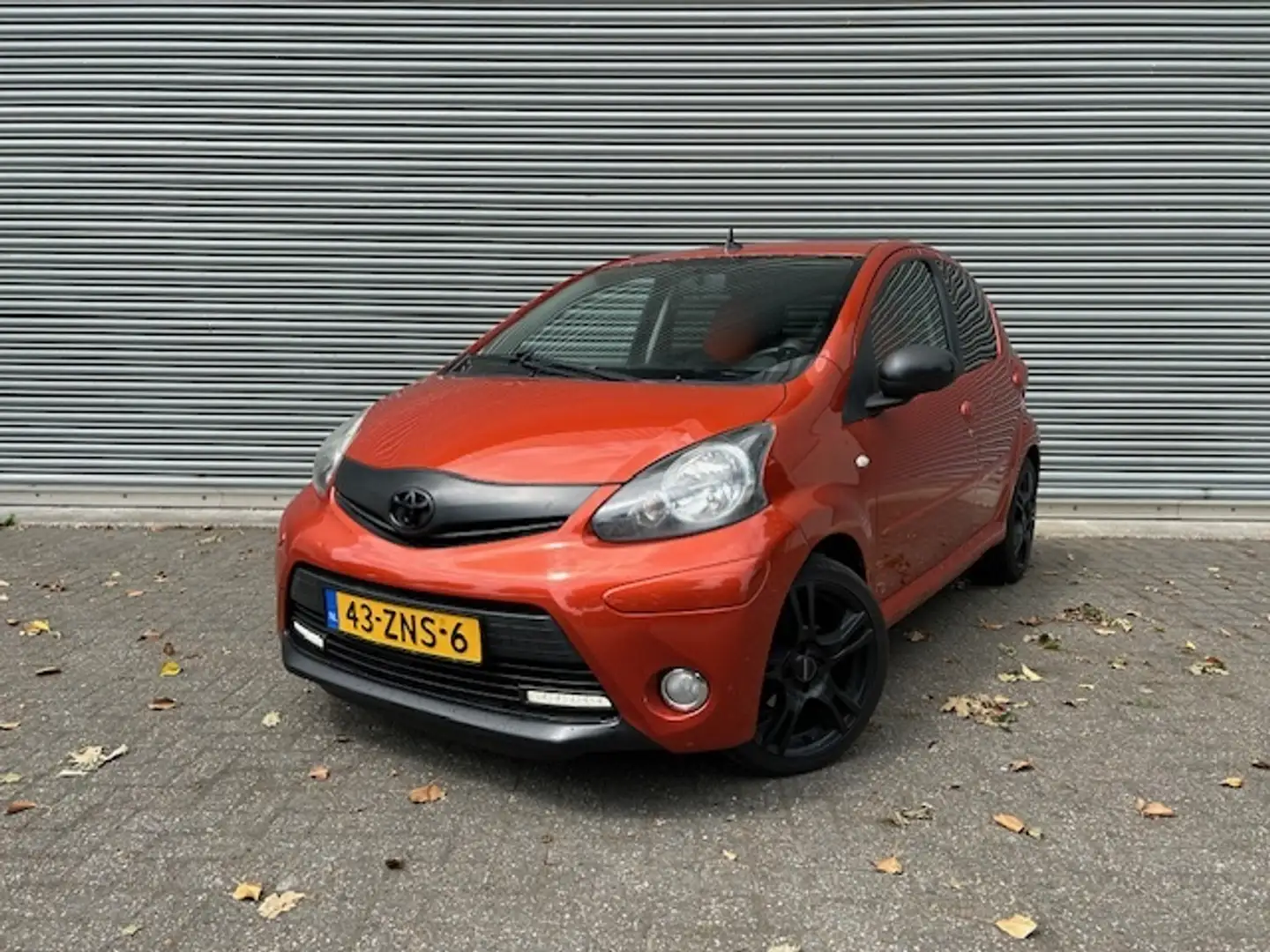Toyota Aygo 1.0 VVT-i Dynamic Orange / NWE APK / SPORT UITVOER Orange - 1