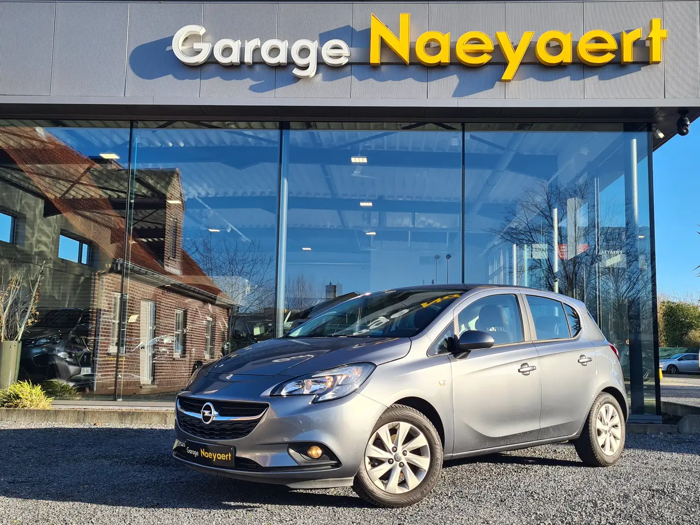 Opel Corsa 1.2i Enjoy * NAVIGATIE, AIRCO, APPLE * Grijs - 1