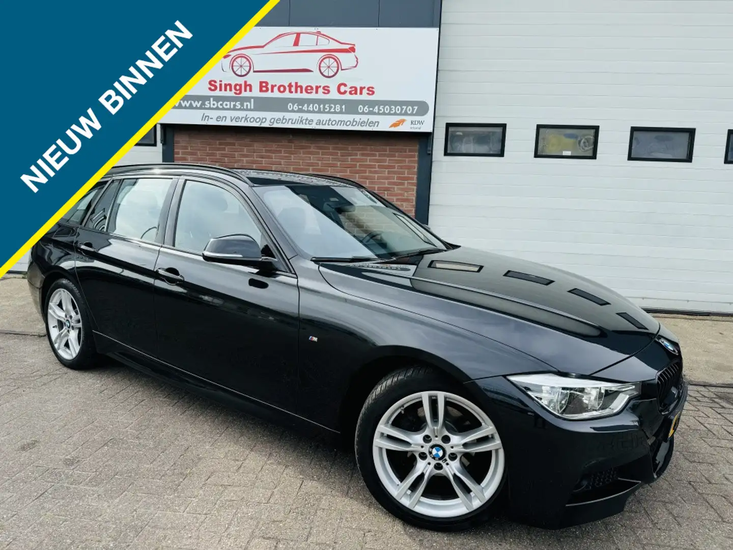 BMW 318 3-serie Touring 318i M-SPORT AUT C PLAY NAP XEN TR Zwart - 1