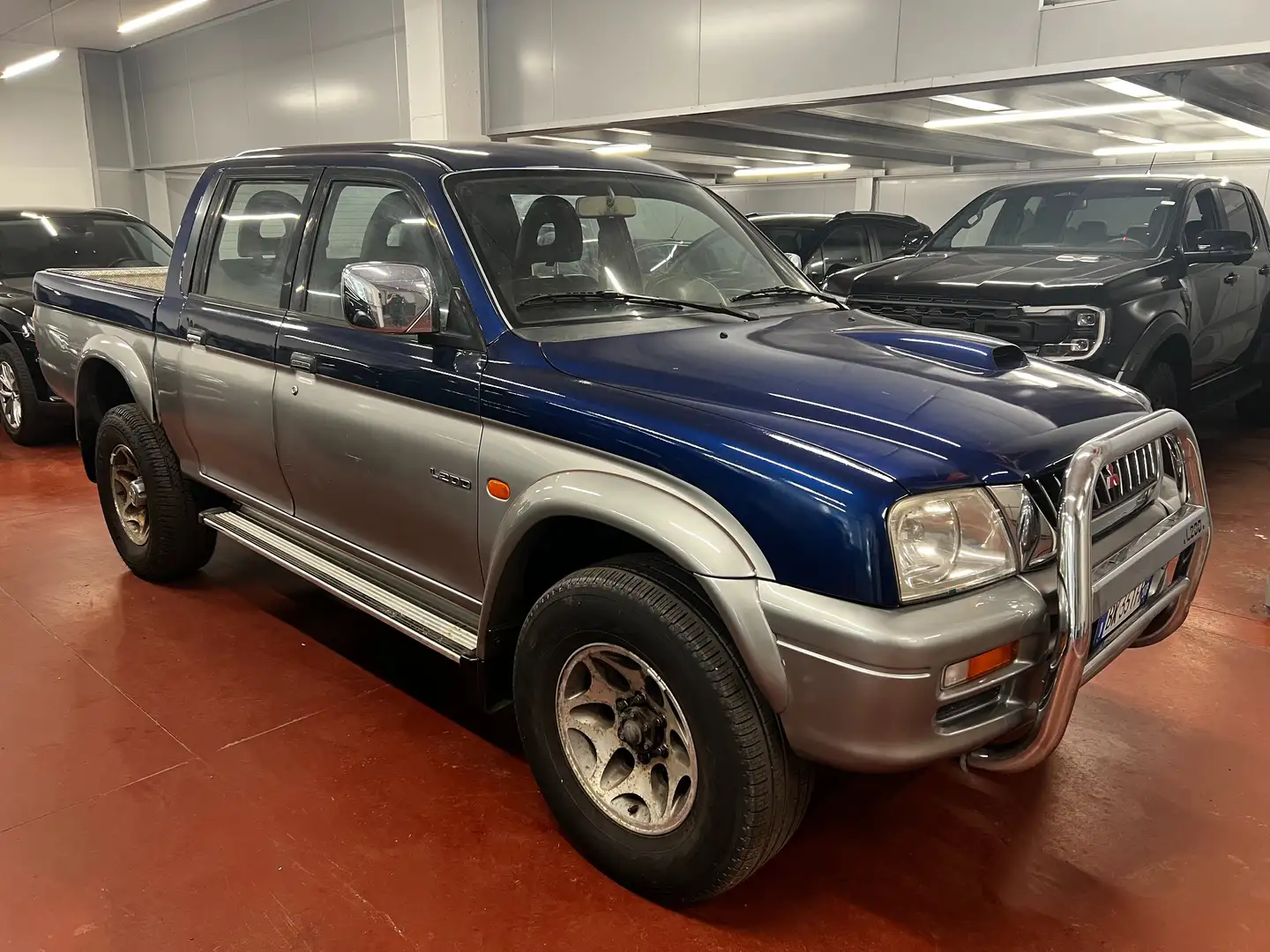 Mitsubishi L200 L200 Cab III d.cab 2.5 tdi GLS Target 4wd Blauw - 1