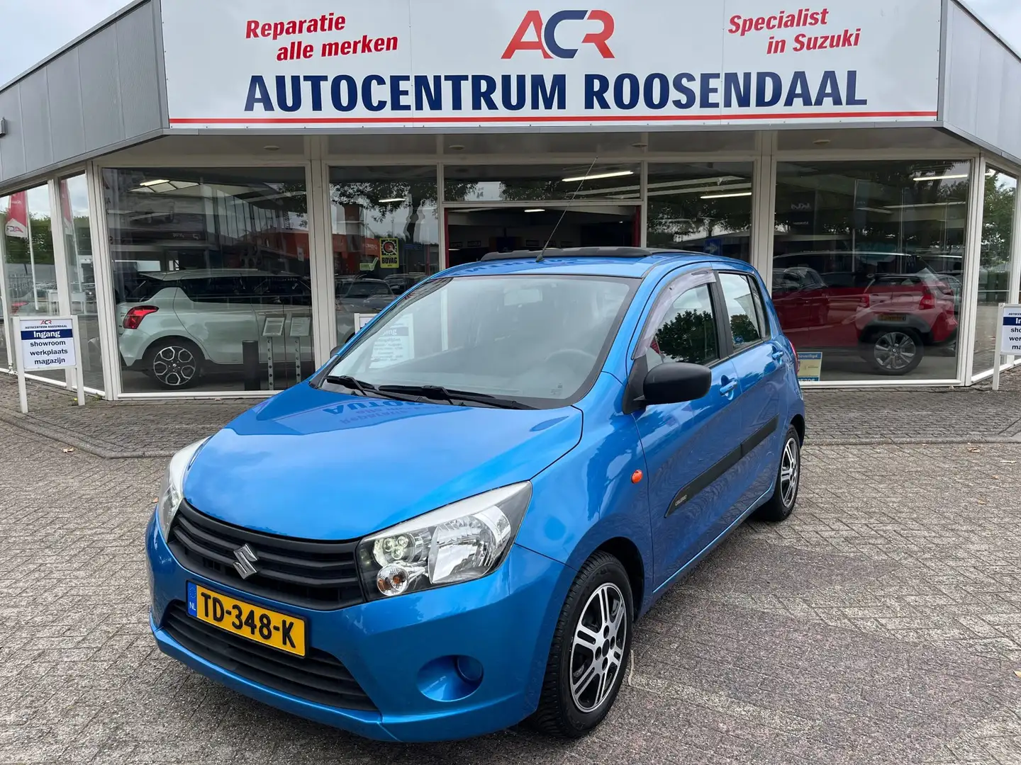 Suzuki Celerio 1.0 Comfort Airco / Trekhaak / OPEN DAK trekhaak Blau - 1