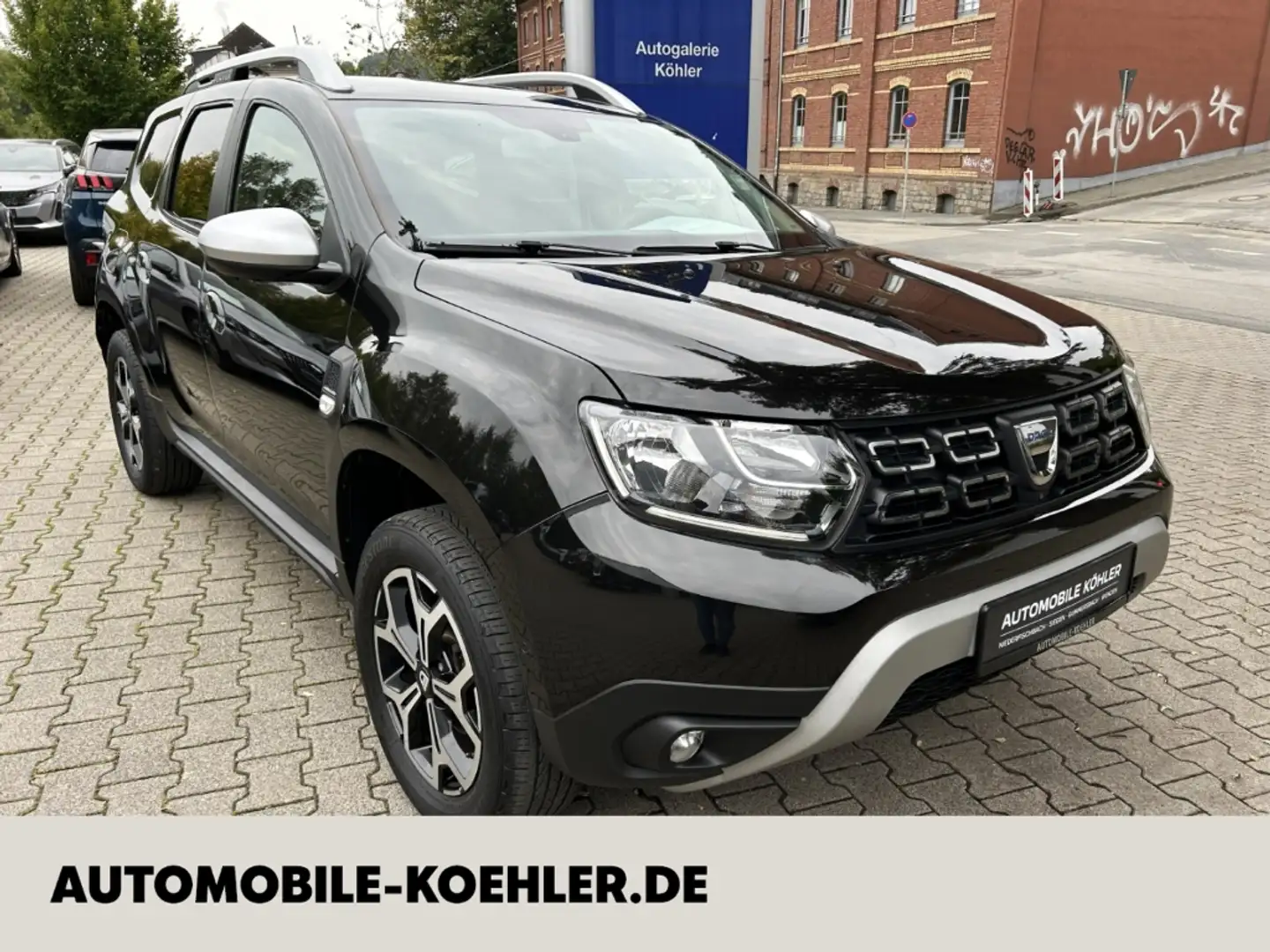 Dacia Duster II 1.6 16V 4x2 Prestige Navi 360 Kamera Klimaautom Schwarz - 1