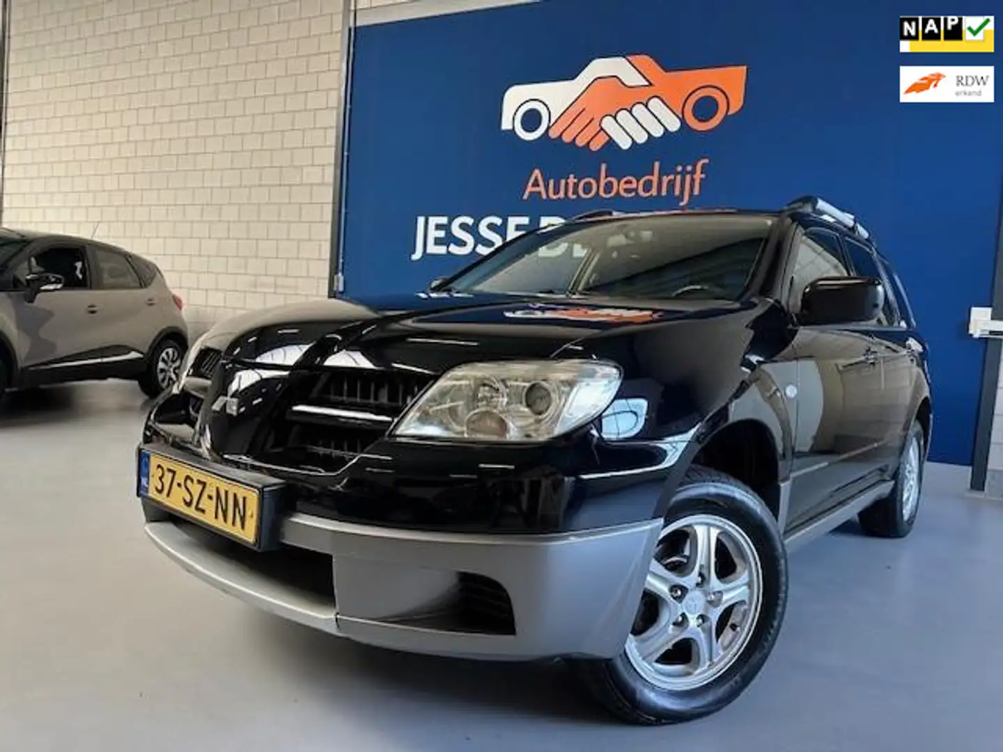 Mitsubishi Outlander Sport 2.0 Invite+/ bj.2006 / kleur: zwart/ NAP met Nero - 1