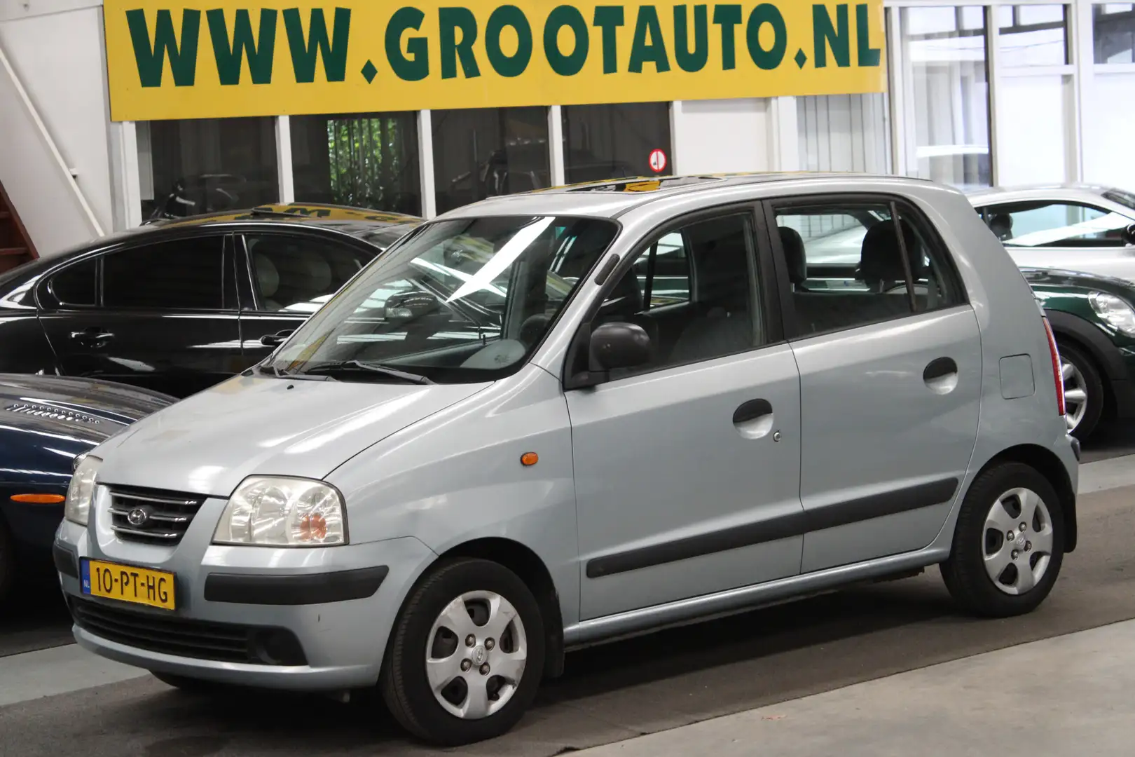 Hyundai Atos 1.1i Active Sky NAP, 5 Deurs, Kanteldak, Stuurbekr Grijs - 1
