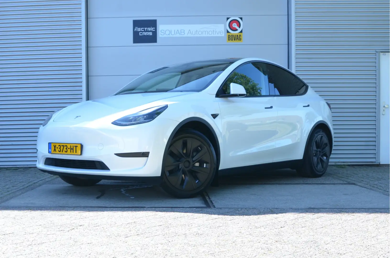 Tesla Model Y RWD 58 kWh AutoPilot, Trekhaak (1.600kg), LFP Accu Wit - 1