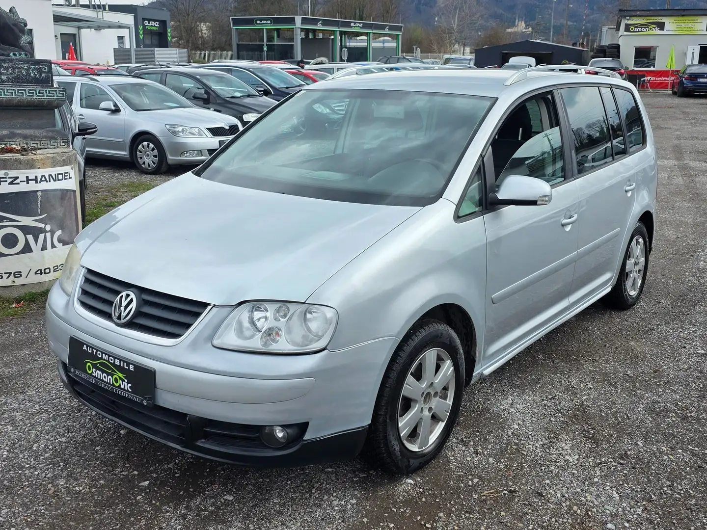 Volkswagen Touran Highline 1,9 TDI DSG Zilver - 1