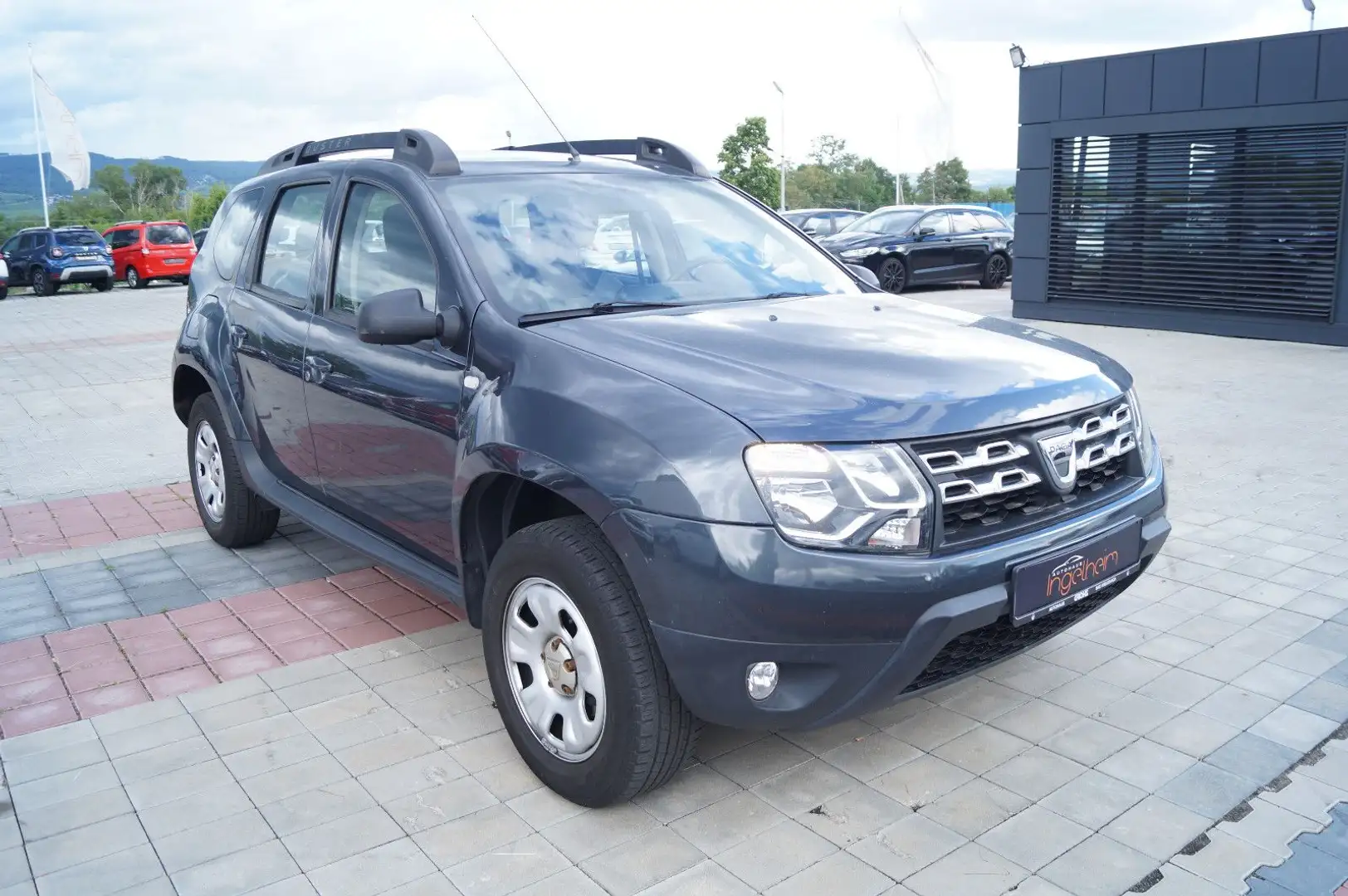 Dacia Duster I Laureate 4x2 Klima Navi PDC SHZ Euro 6 Grau - 1