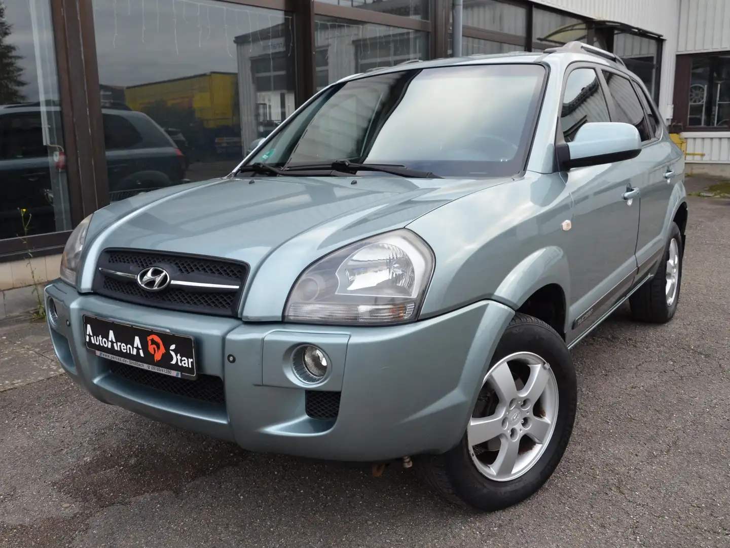 Hyundai TUCSON 2.7 GLS 4WD,Alu,Airbag,Klima,PDC,Shz,Servo,CD-R Grau - 1